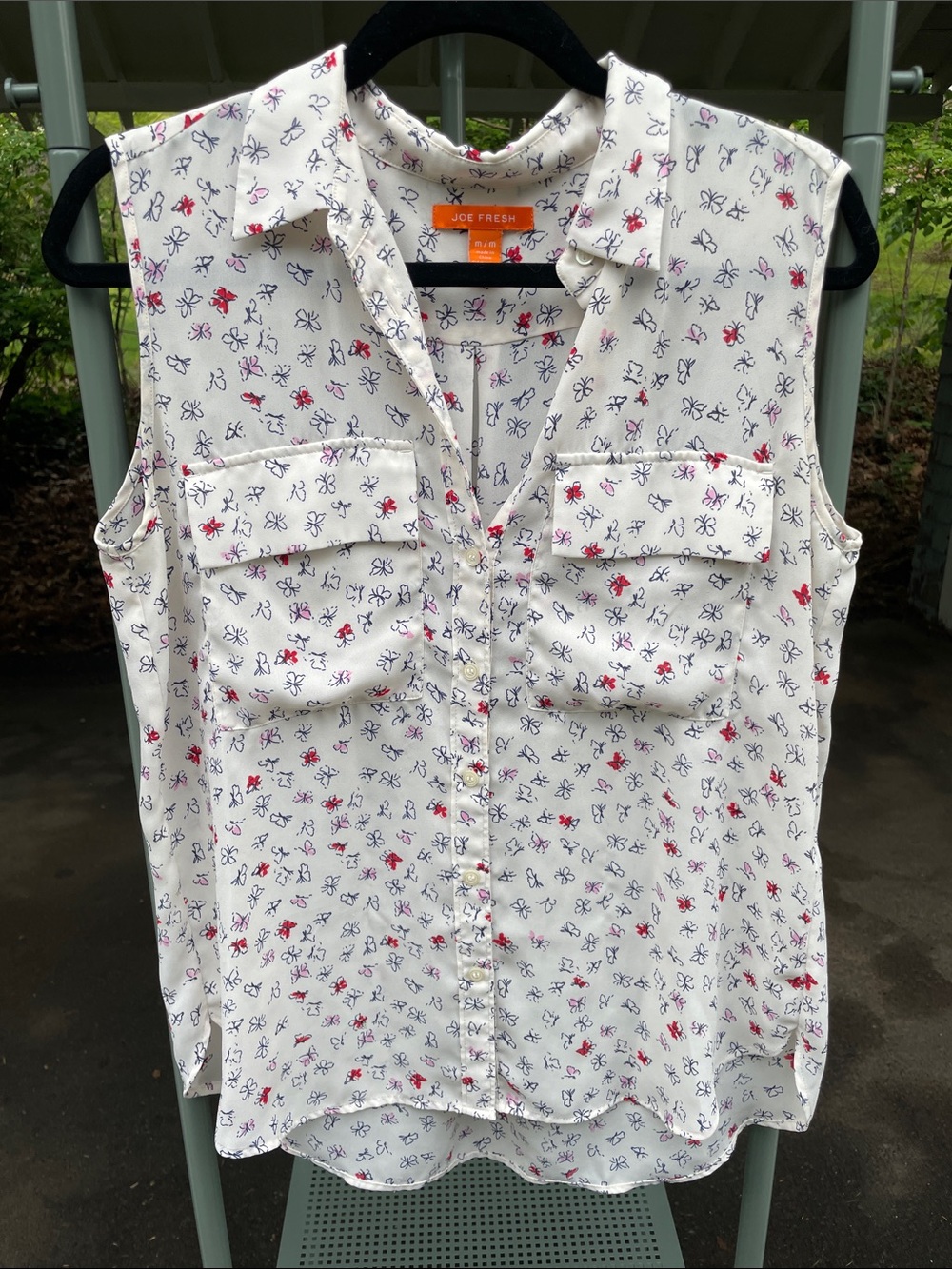 Sleeveless, collared, button down blouse with butterfly print. Joe Fresh, size M